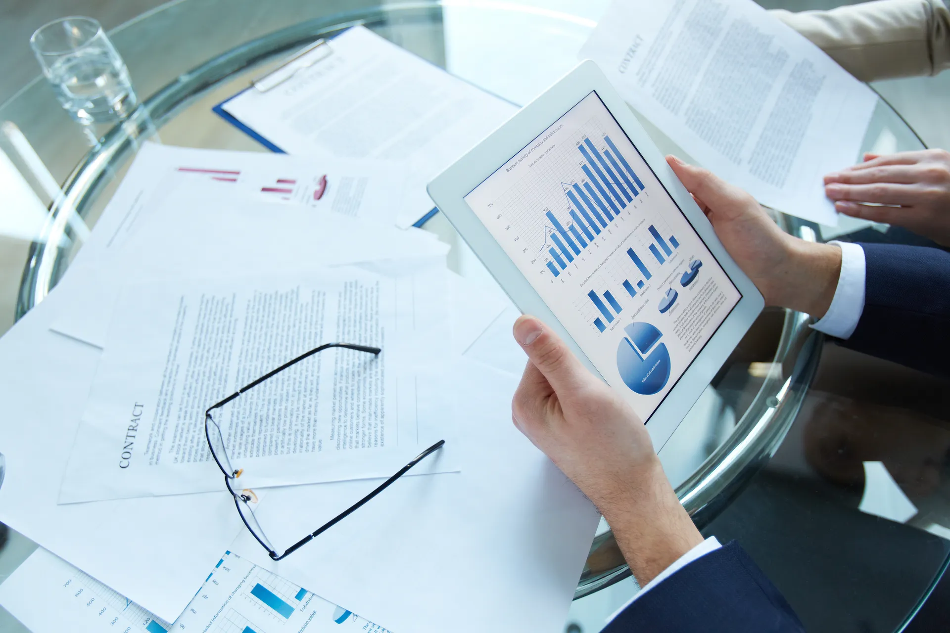 Business partners discussing documents at meeting