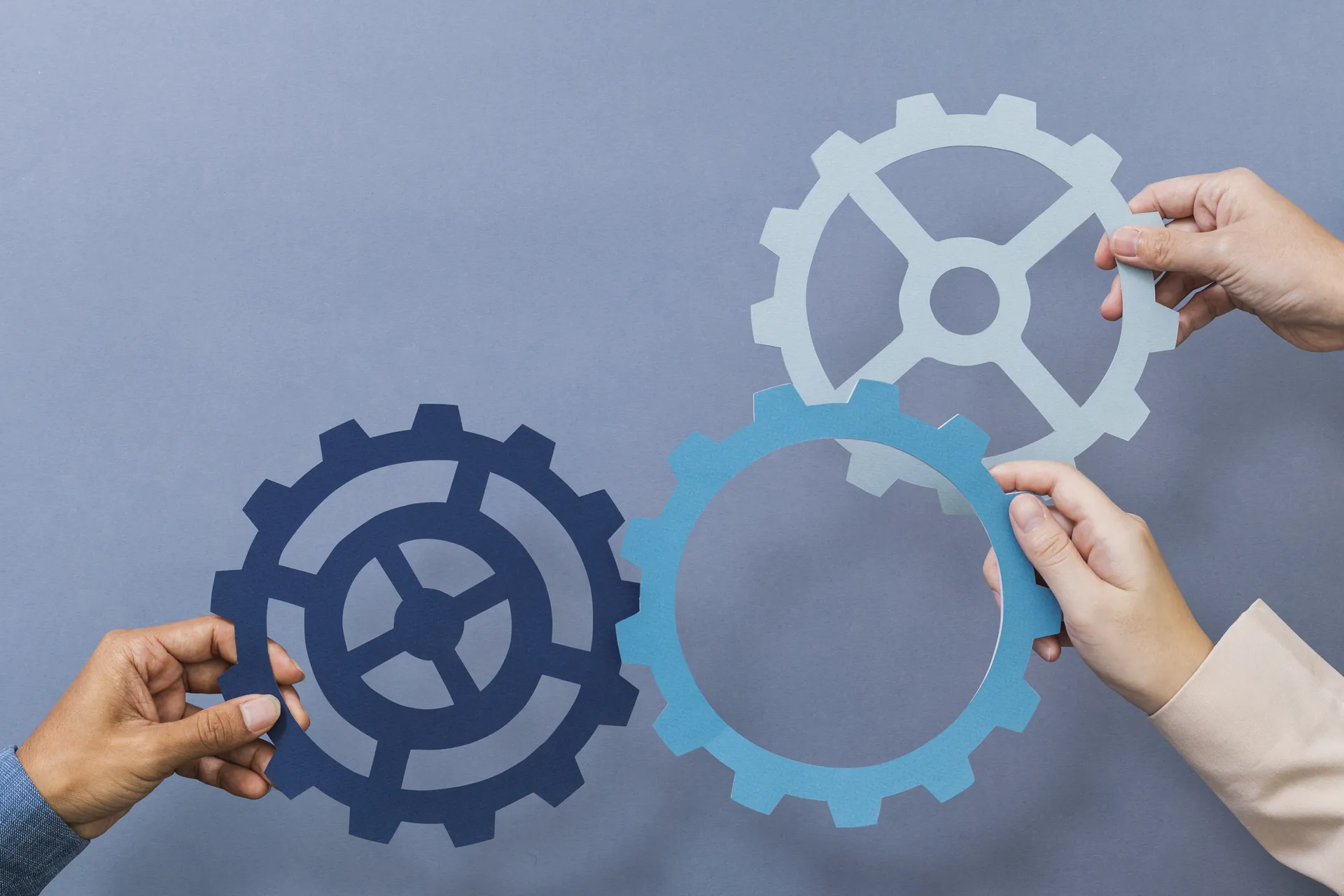 COGWHEELS CONNECTING TOGETHER.